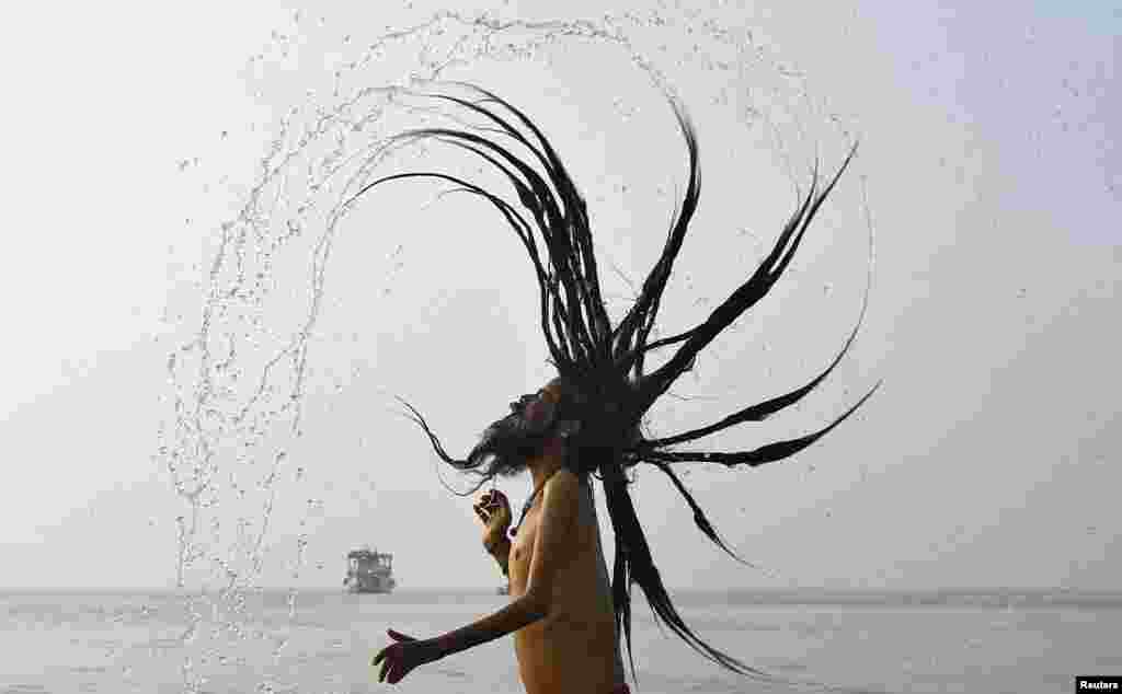 A &quot;Sadhu&quot;, or Hindu holy man, takes a dip at the confluence of the river Ganges and the Bay of Bengal, ahead of the &quot;Makar Sankranti&quot; festival at Sagar Island, south of Kolkata, India.