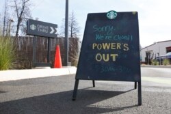 A sign at the entrance of the drive-thru at Starbucks warns customers the store is closed due to a power outage in Paradise, California, Oct. 24, 2019.