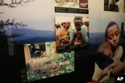 FILE—Family photographs of some of those who died hang in a display in the Kigali Genocide Memorial Centre in Kigali, Rwanda, April 4, 2024.