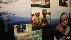 FILE—Family photographs of some of those who died hang in a display in the Kigali Genocide Memorial Center in Kigali, Rwanda, Tuesday, April 4, 2024.