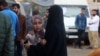 Palestinian women react after identifying a victim killed an Israeli strike on the Nuseirat refugee camp, in front of the al-Aqsa Martyrs hospital in Deir el-Balah in the central Gaza Strip, on Nov. 1, 2024.