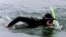 FILE - French-American swimmer Ben Lecomte is seen during his 1998 trans-Atlantic swim, off the Brittany port of Quiberon.
