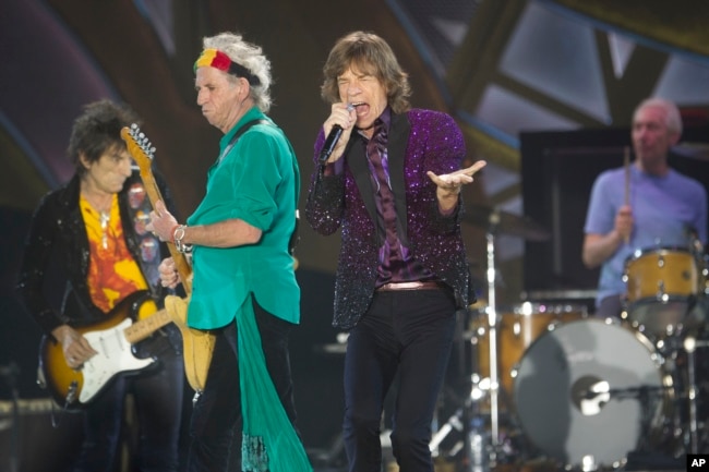 FILE - In this June 4, 2014, file photo, Rolling Stones singer Mick Jagger, performs with Keith Richards, second left, Ronnie Wood, left, and drummer Charlie Watts during a concert in Hayrkon Park in Tel Aviv, Israel. (AP Photo/Ariel Schalit, File)