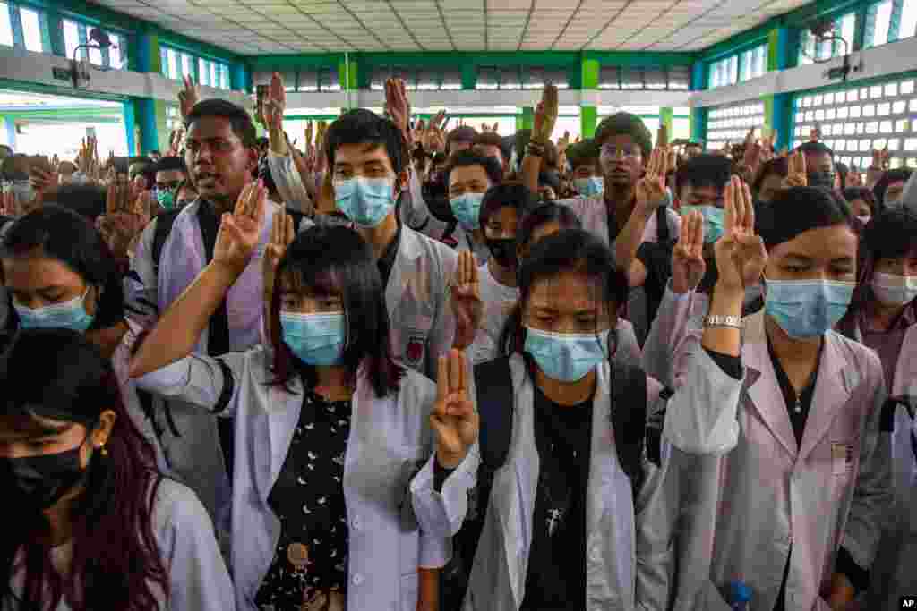 Fellow medical students flash three-fingered salute during the funeral of Khant Ngar Hein in Yangon, Myanmar. The 18-year-old medical student was shot on his chest on Sunday in Tamwe, Yangon by security forces during an anti-coup protest.