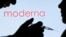 FILE - People pose with a syringe in front of a Moderna logo. Moderna, along with fellow pharmaceutical company Merck, announced Dec. 14, 2023, they had found success in reducing the chance of recurrence of melanoma by combining a Moderna vaccine with Merck's Keytruda.
