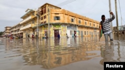 A man wades through a flooded street in Hamerweyne district of Mogadishu, Somalia, May 20, 2018. 