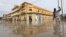 A man wades through a flooded street in Hamerweyne district of Mogadishu, Somalia, May 20, 2018. 