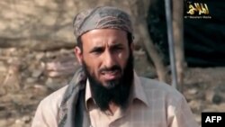 FILE - AQAP chief Nasir al-Wuhayshi allegedly addressing scores of jihadists at an undisclosed location in Yemen.