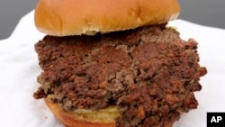 This is the "Impossible Burger," made from wheat protein, coconut oil, potato protein and other ingredients, shown in Bellevue, Neb., Jan. 11, 2019. A report released Jan. 16, 2019, by a panel of nutrition, agriculture and environmental experts recommends a plant-based diet.