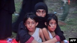 Newly arrived Rohingya refugees rest at a shelter as they wait to be registered by the UNHCR in Kuala Parek, Indonesia's East Aceh on February 2, 2024.