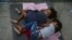 FILE - Migrant children sleep on a mattress on the floor of the AMAR migrant shelter in Nuevo Laredo, Mexico, July 17, 2019. The ACLU said Thursday that more than 5,400 children were separated from their parents by the Trump administration.
