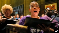 Dallas Street Choir singers Debra Scott, left rear, and Elizabeth Armstrong sings during a rehearsal for the their Carnegie Hall appearance, June 13, 2017.