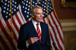 FILE - This Oct. 26, 2020, file photo shows Sen. Rob Portman, R-Ohio, speaking during a news conference in Washington.