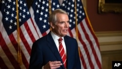 FILE - Sen. Rob Portman, R-Ohio, speaks during a news conference in Washington, Oct. 26, 2020.