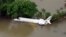 An aerial view of a partially submerged airplane in a flood affected area in Chennai, India