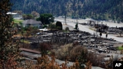 Damaged structures are seen in Lytton, British Columbia, July 9, 2021, after a wildfire destroyed most of the village on June 30. (Canadian Press via AP)