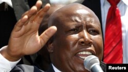 FILE: South African former African National Congress (ANC) Youth League leader Julius Malema addresses his supporters after his court appearance in Polokwane, South Africa, September 26, 2012.