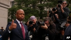 FILE - New York City mayor Eric Adams departs Manhattan federal court after an appearance, Sept. 27, 2024, in New York. 