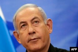 Israeli Prime Minister Benjamin Netanyahu looks on as he addresses media during a joint press conference with French President in Jerusalem on October 24, 2023.