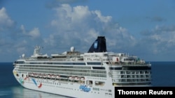 Cruise ship Norwegian Dawn departs port near Hamilton Bermuda, Aug. 6, 2021. 