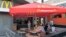 People sit outside a closed McDonald's restaurant in Moscow, August 20, 2014.