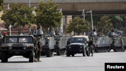 Lebanese Army soldiers secure a street they have closed off, where anti-Hezbollah activists had earlier held a protest, in Beirut June 9, 2013. 