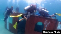 A shipping container was dropped in the coast of Sihanoukville to create artificial coral reefs. (Courtesy of National Committee For Maritime Security)