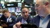 Traders work on the floor of the New York Stock Exchange in New York City, June 10, 2016.