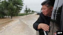 This picture taken on July 28, 2024 and released from North Korea's official Korean Central News Agency (KCNA) via KNS on July 29, 2024 shows North Korea's leader Kim Jong Un inspecting flood damage in Sinuiju, North Pyongan province.