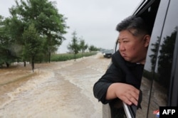 FILE - This picture taken July 28, 2024, and released by North Korea's official Korean Central News Agency via KNS shows leader Kim Jong Un surveying flood damage after record-breaking rains in Sinuiju, North Pyongan province.