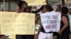 FILE - Women protest against dress code legislation, Feb. 26, 2014, in Kampala, Uganda. This week, the country's goverment introduced a new dress code for civil servants. 