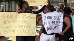 FILE - Women protest against dress code legislation, Feb. 26, 2014, in Kampala, Uganda. This week, the country's goverment introduced a new dress code for civil servants. 