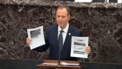In this image from video, House impeachment manager Rep. Adam Schiff holds redacted documents as he speaks during the impeachment trial of President Donald Trump, in the Senate at the Capitol in Washington, Jan. 22, 2020.