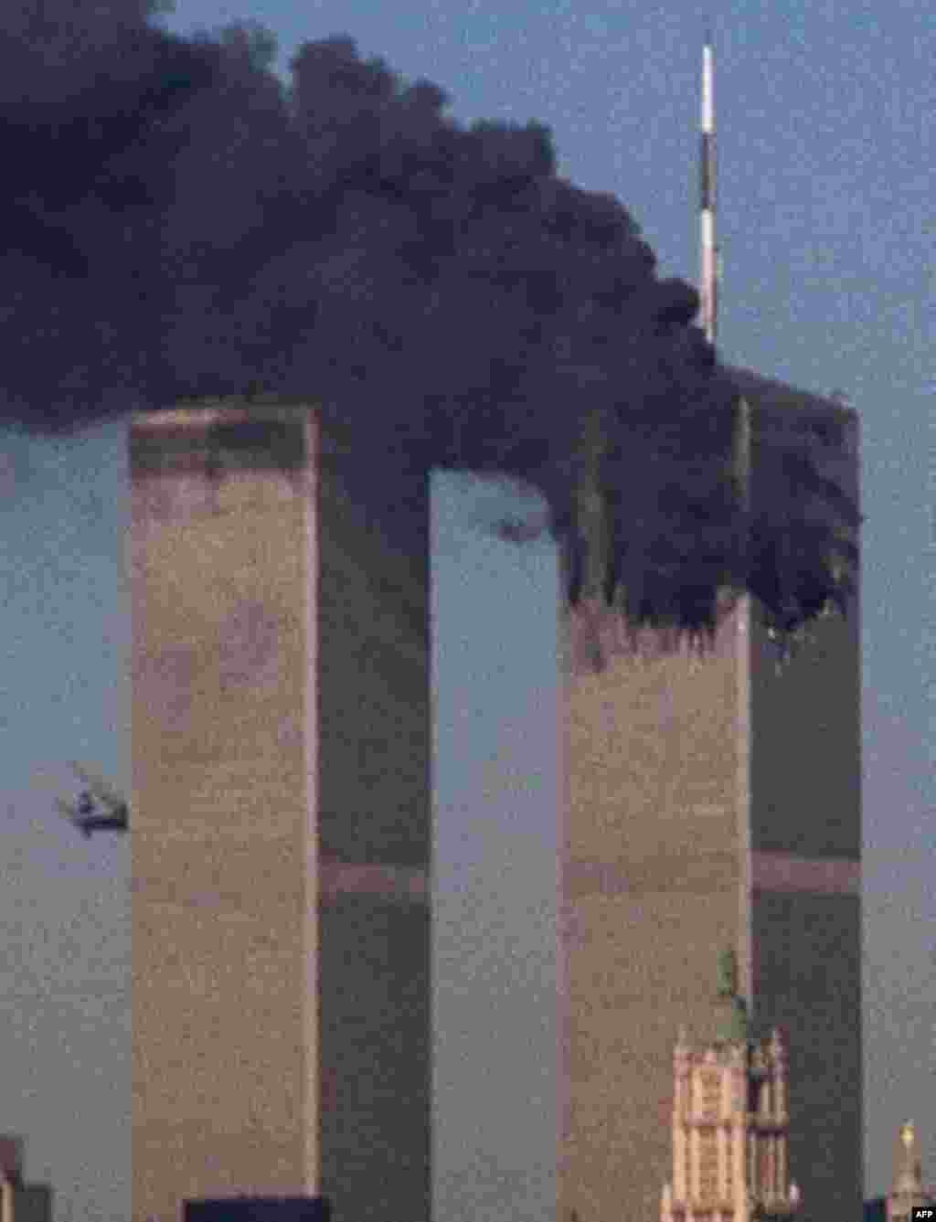 A jet crashes into the World Trade Center in New York, Tuesday, Sept. 11, 2001. Terrorists crashed two planes into the World Trade Center, and the twin 110-story towers collapsed Tuesday morning. (AP Photo/Moshe Bursuker)