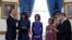 President Barack Obama takes the oath of office at the official swearing-in ceremony in the Blue Room of the White House in Washington, DC, Sunday, Jan. 20, 2013, holding the family bible is First Lady Michele Obama, administering the oath is Supreme Cour