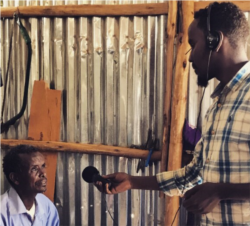 Mahad interviews a man at the Bokolmanyo refugee camp, in Bokolmanyo, Ethiopia. (Photo courtesy Dr Vandana Sharma)