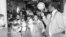 Harlem Globetrotter Meadowlark Lemon balances a basketball on his finger for children attending a children's benefit toy auction at New York's Tavern on the Green, April 23, 1979.