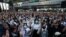 Pro-democracy protesters show the three-finger salute during an anti-government protest, in Bangkok, Thailand, Oct. 19, 2020.