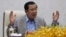 FILE - Cambodia's Prime Minister Hun Sen gestures during a speech on the current state of a new virus from China in Phnom Penh, Cambodia, Thursday, Jan. 30, 2020.