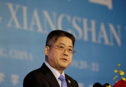 FILE - China's Vice Foreign Minister Le Yucheng speaks at a forum in Beijing, China, Oct. 22, 2019.  In a carefully worded statements, Le said on Thursday that Beijing hopes "the next U.S. government will meet China halfway."