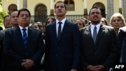 The new president of Venezuela's National Assembly, Juan Guaido, center, First Vice President Edgar Zambrano, left, and Second Vice President Stalin Gonzalez are pictured after the inauguration ceremony in Caracas, Jan. 5, 2019. 