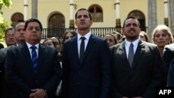 The new president of Venezuela's National Assembly, Juan Guaido, center, First Vice President Edgar Zambrano, left, and Second Vice President Stalin Gonzalez are pictured after the inauguration ceremony in Caracas, Jan. 5, 2019. 