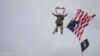 U.S. World War II D-Day veteran Tom Rice, from Coronado, California, parachutes in a tandem jump into a field in Carentan, Normandy, France, June 5, 2019. 