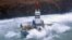Waves crash over the conical drilling unit Kulluk where it sits aground on the southeast side of Sitkalidak Island, Alaska in this U.S. Coast Guard handout photo taken January 1, 2013.