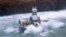 Waves crash over the conical drilling unit Kulluk where it sits aground on the southeast side of Sitkalidak Island, Alaska in this U.S. Coast Guard handout photo taken January 1, 2013.