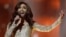 Singer Conchita Wurst representing Austria performs the song ' Rise Like a Phoenix' during a rehearsal for the second semifinal of the Eurovision Song Contest in the B&W Halls in Copenhagen, Denmark, May 7, 2014.