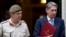 Britain's Defense Secretary Philip Hammond, right, and the Chief of Defense Staff Gen. Nick Houghton leave 10 Downing street following a national security meeting at Dow ning Street in London, Aug. 28, 2013.