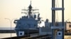 The USS Fort Lauderdale remains docked in the port of La Guaira, Venezuela.