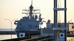 The USS Fort Lauderdale remains docked in the port of La Guaira, Venezuela.