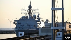 The USS Fort Lauderdale remains docked in the port of La Guaira, Venezuela.